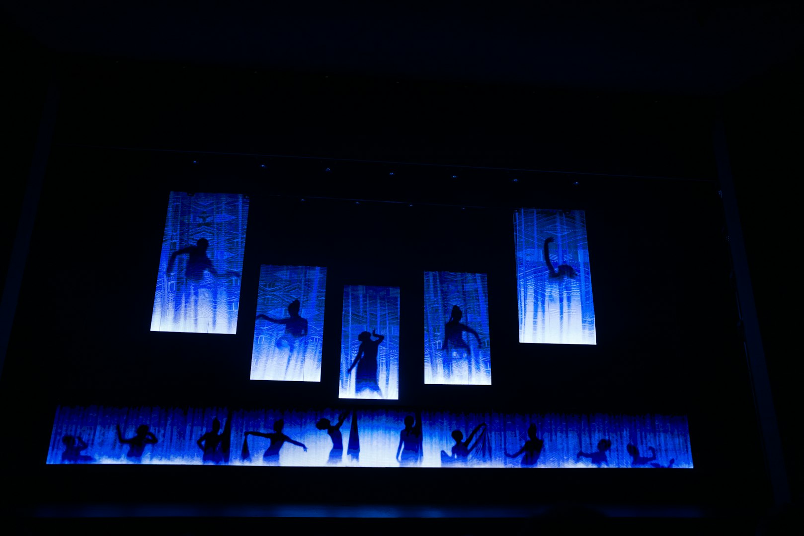 man singing on stage